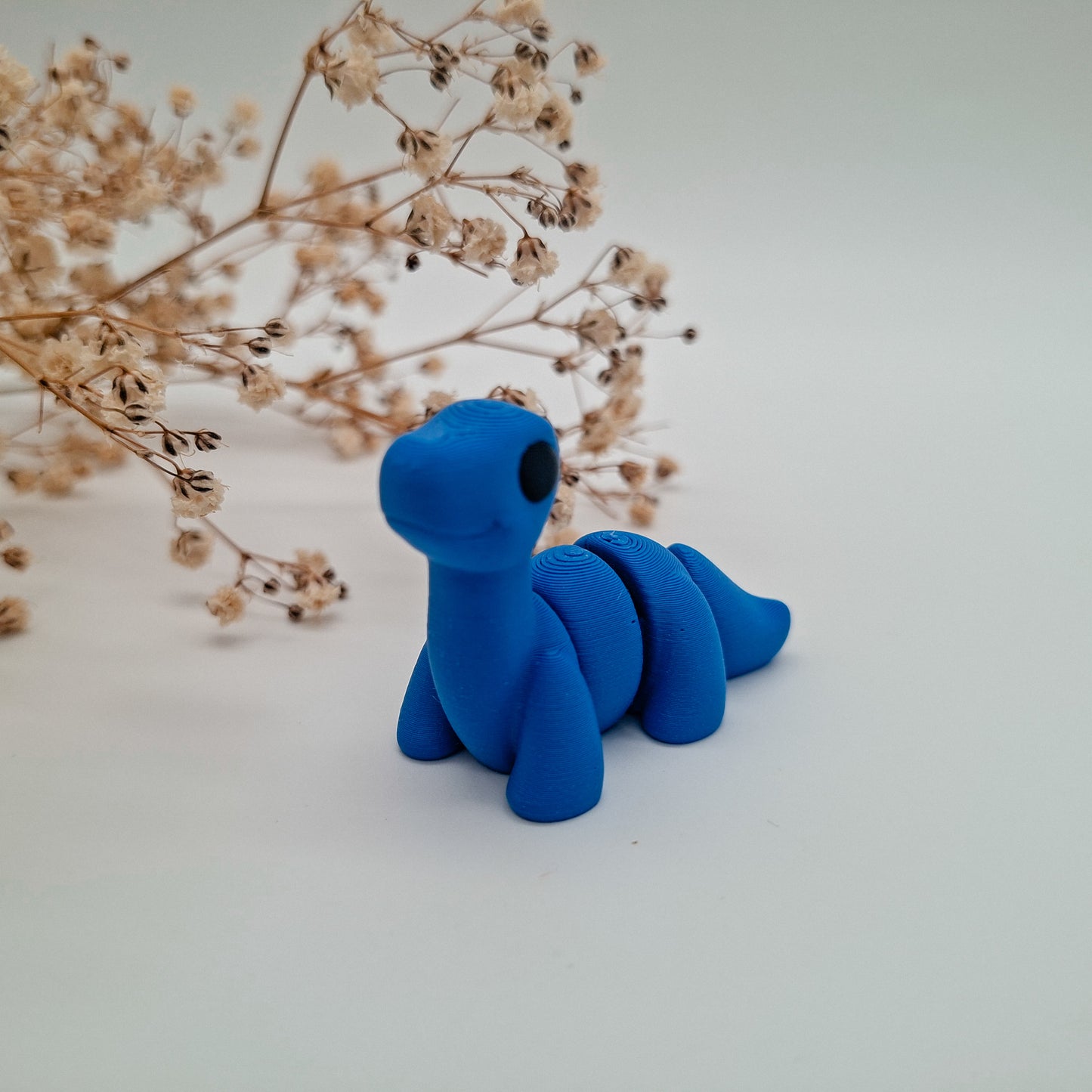 Jiggle Baby Brontosaurus – Dein kleiner Glücksbringer