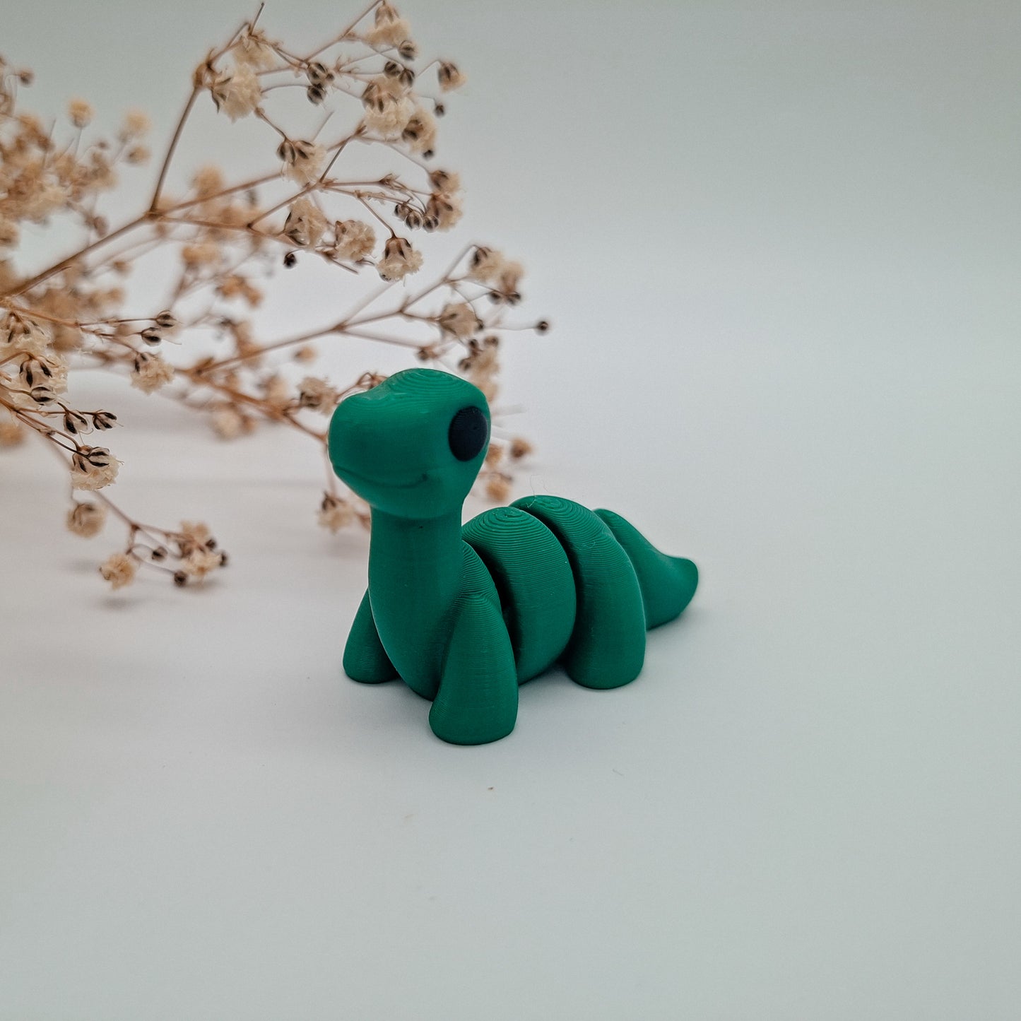 Jiggle Baby Brontosaurus – Dein kleiner Glücksbringer