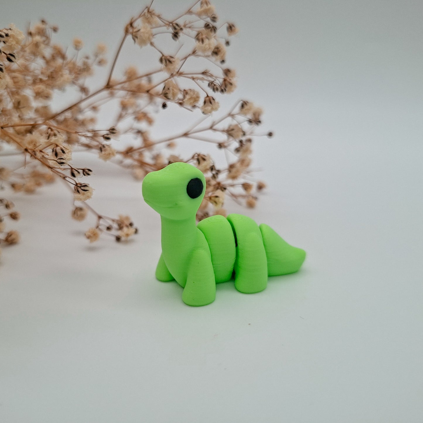Jiggle Baby Brontosaurus – Dein kleiner Glücksbringer