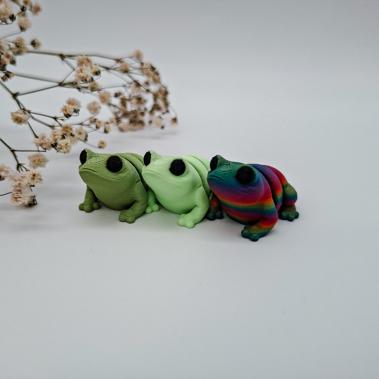 Jiggle Baby Po-Frosch – Bunter Wackelfreund