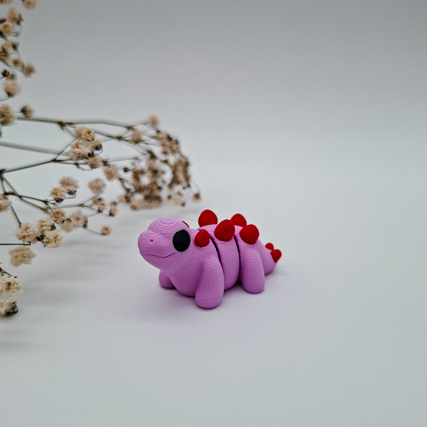 Jiggle Baby Stegosaurus – Bunter Wackelfreund