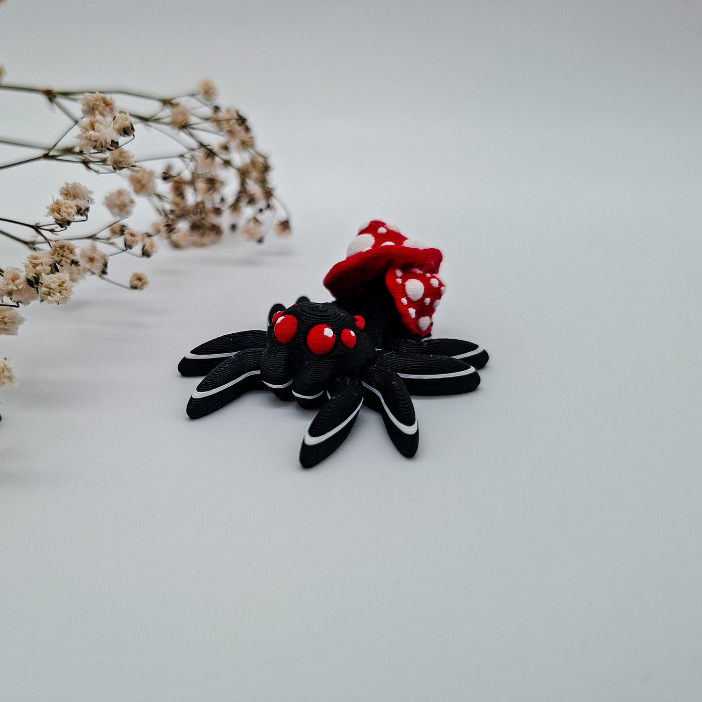 Jiggle Fliegenpilz Spinne - Bunter Wackelfreund