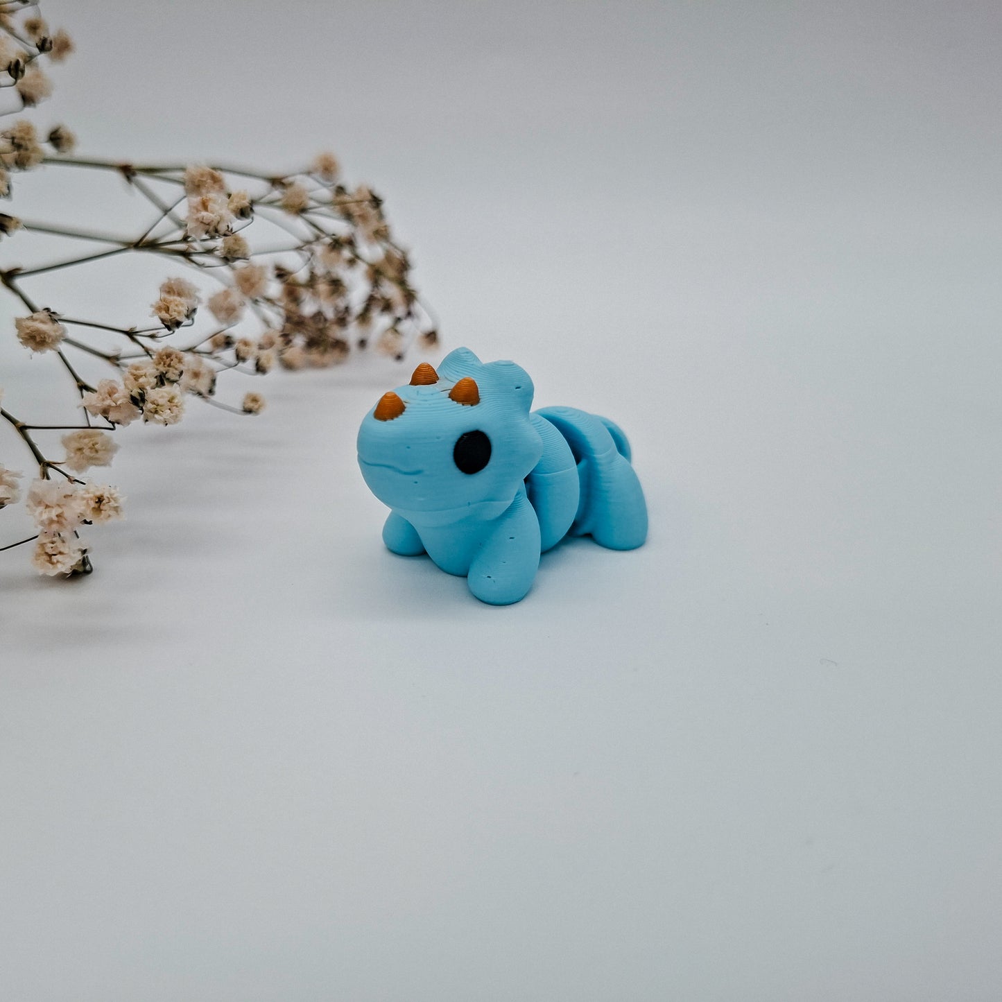 Jiggle Baby Triceratops – Bunter Wackelfreund