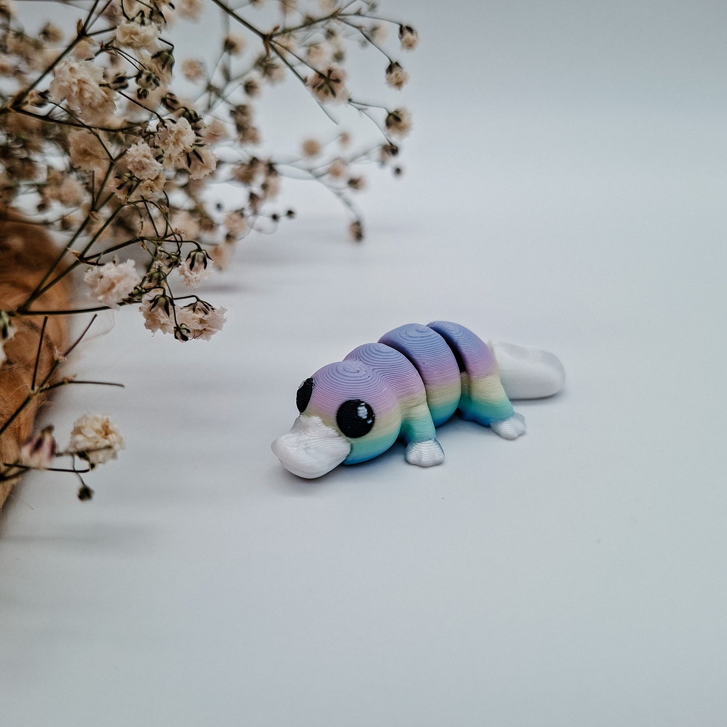 Jiggle Baby Schnabeltier - Dein glitzernder Wackelheld