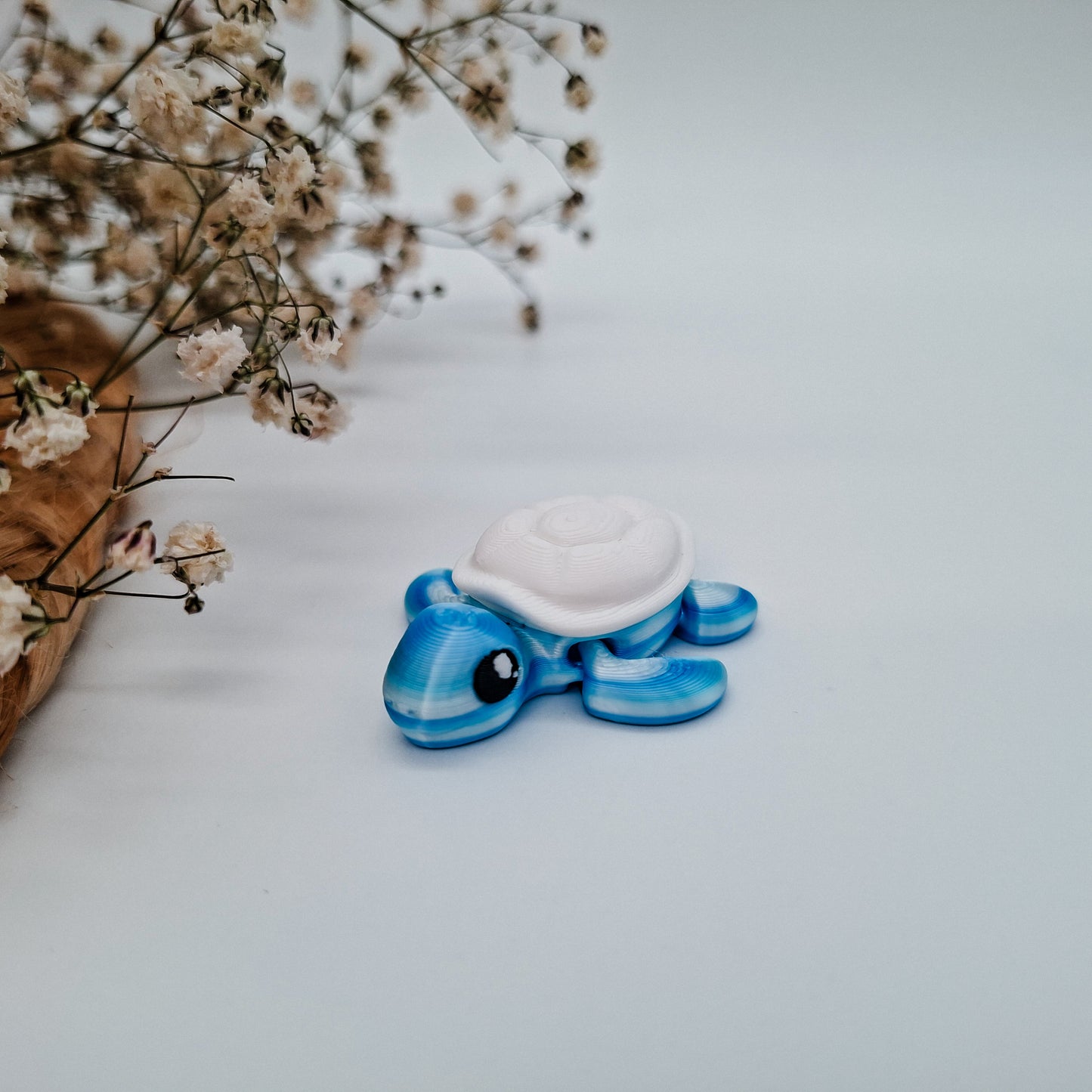 Jiggle Baby Schildkröte - Dein glitzernder Wackelheld